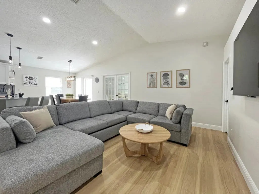 Large living room with enough space for everyone to spread out. Check out the large screen TV.